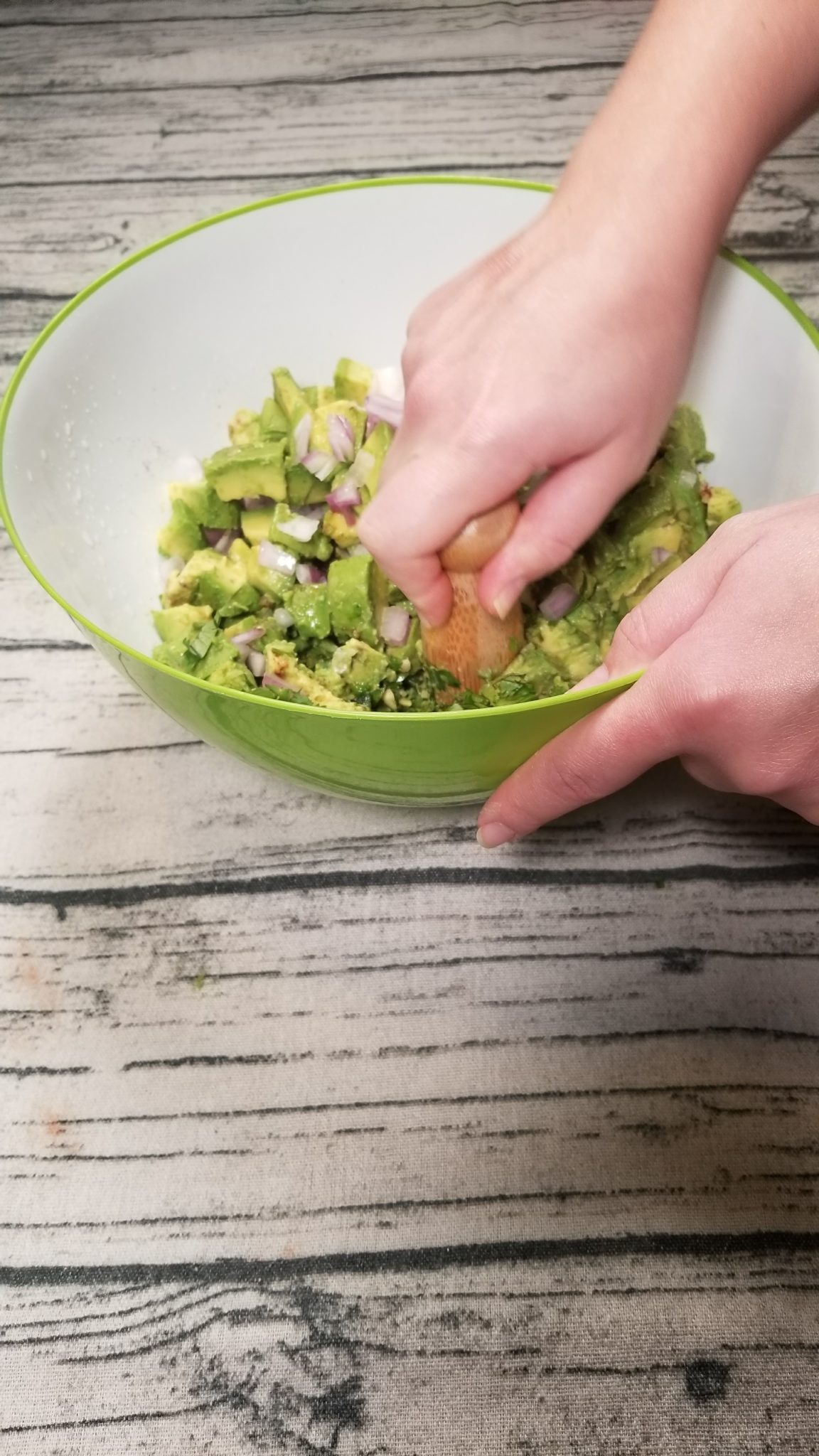Mixing guacamole ingredients