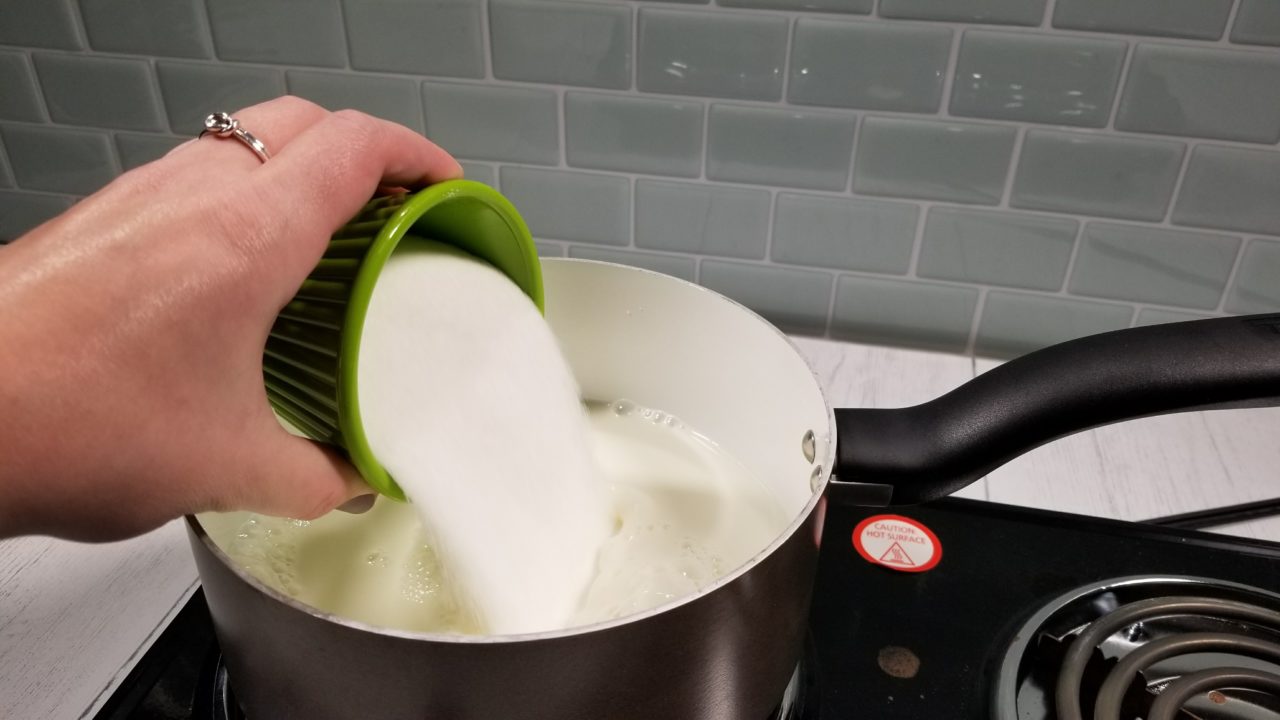 Pouring sugar into saucepan, Mexican Egg Nog
