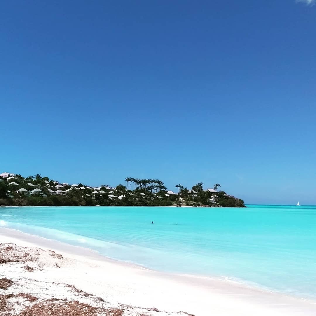 Beach view of Antigua with houses in background
