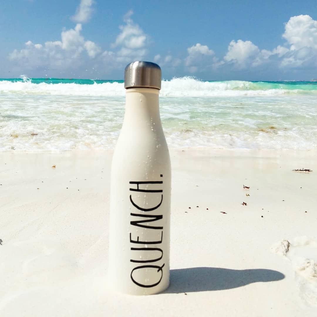 Water bottle saying quench on the beach in cancun