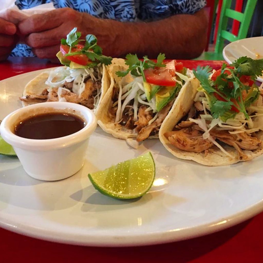 Jerk Chicken tacos on plate. 